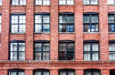 close up of a brick apartment building in new york