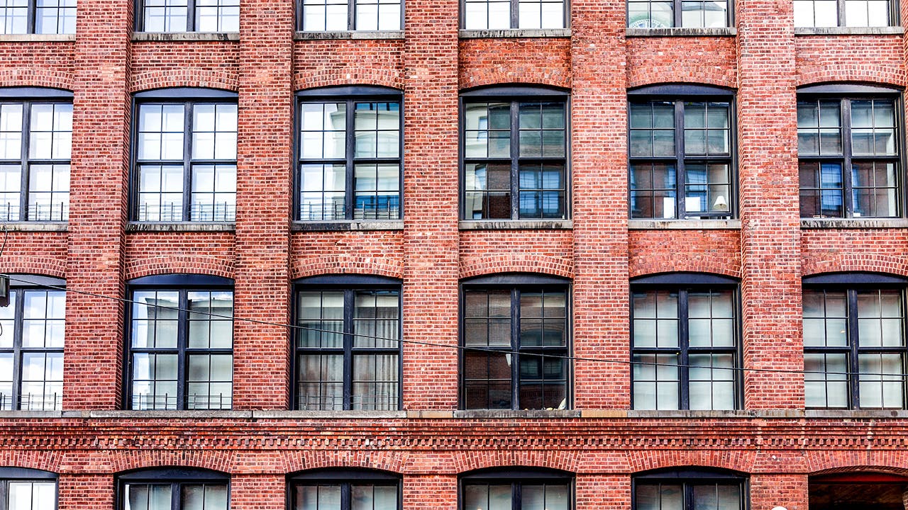 close up of a brick apartment building in new york