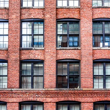 close up of a brick apartment building in new york