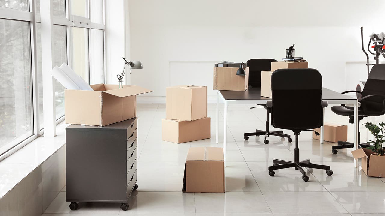 cardboard boxes on moving day inside of an office