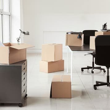 cardboard boxes on moving day inside of an office