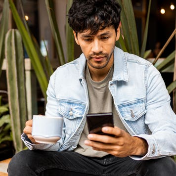Man sitting outside on smartphone