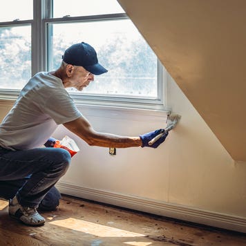 man painting a wall