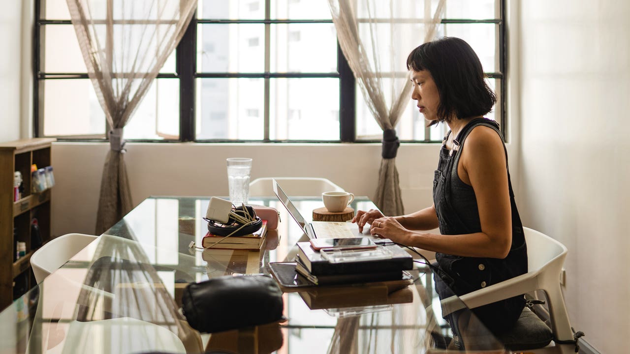 woman working on her laptop at home