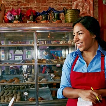 Woman taking orders in a bakery