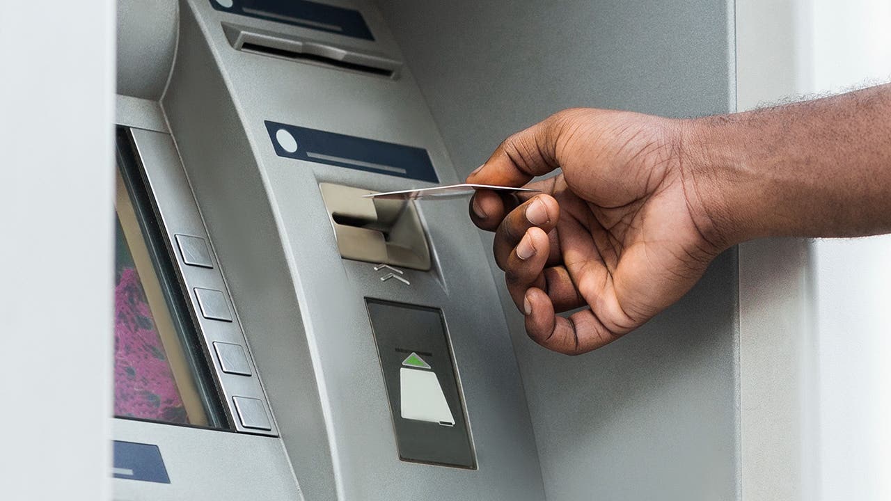 man using an atm