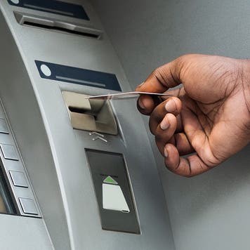 man using an atm