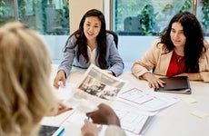 two realtors discussing properties with a client