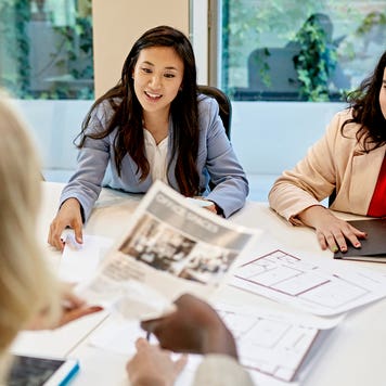 two realtors discussing properties with a client