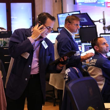 Stock traders looking focus and busy on the trading floor