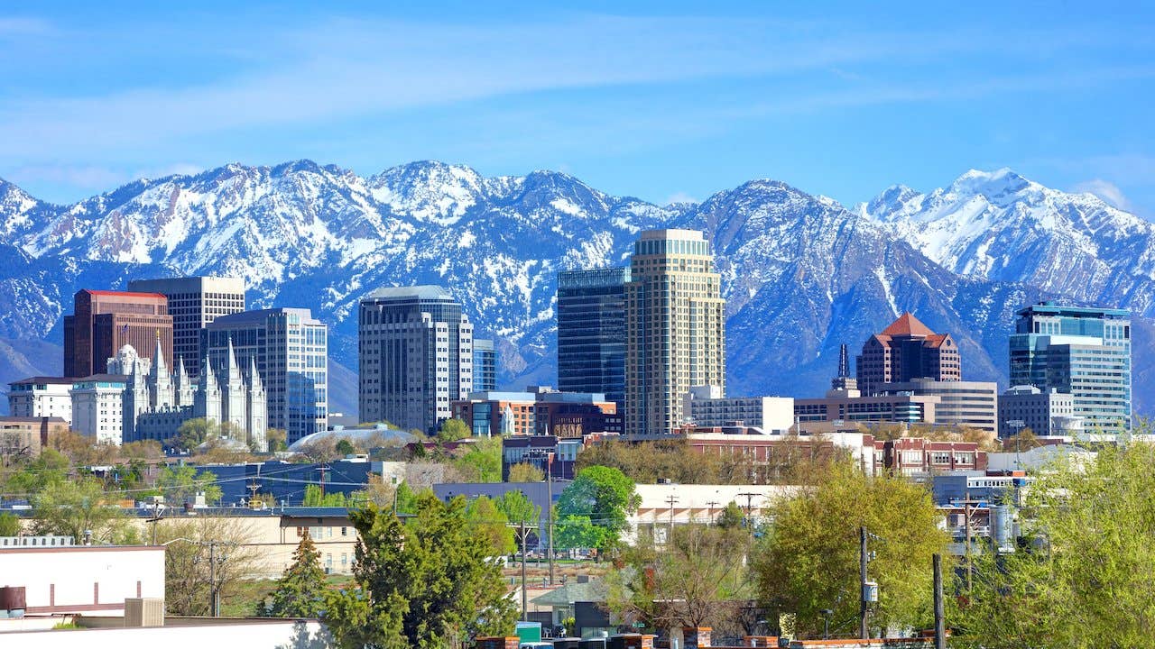 Skyline of Salt Lake City, Utah, with snow covered mountains in background