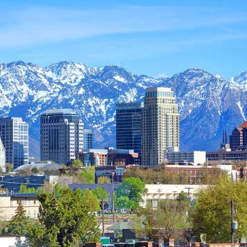 Skyline of Salt Lake City, Utah, with snow covered mountains in background