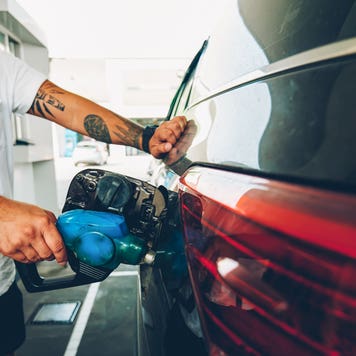 man pumping gas into his car