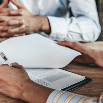 people signing a contract