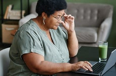 Black Senior Woman Using Laptop