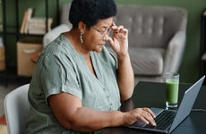 Black Senior Woman Using Laptop