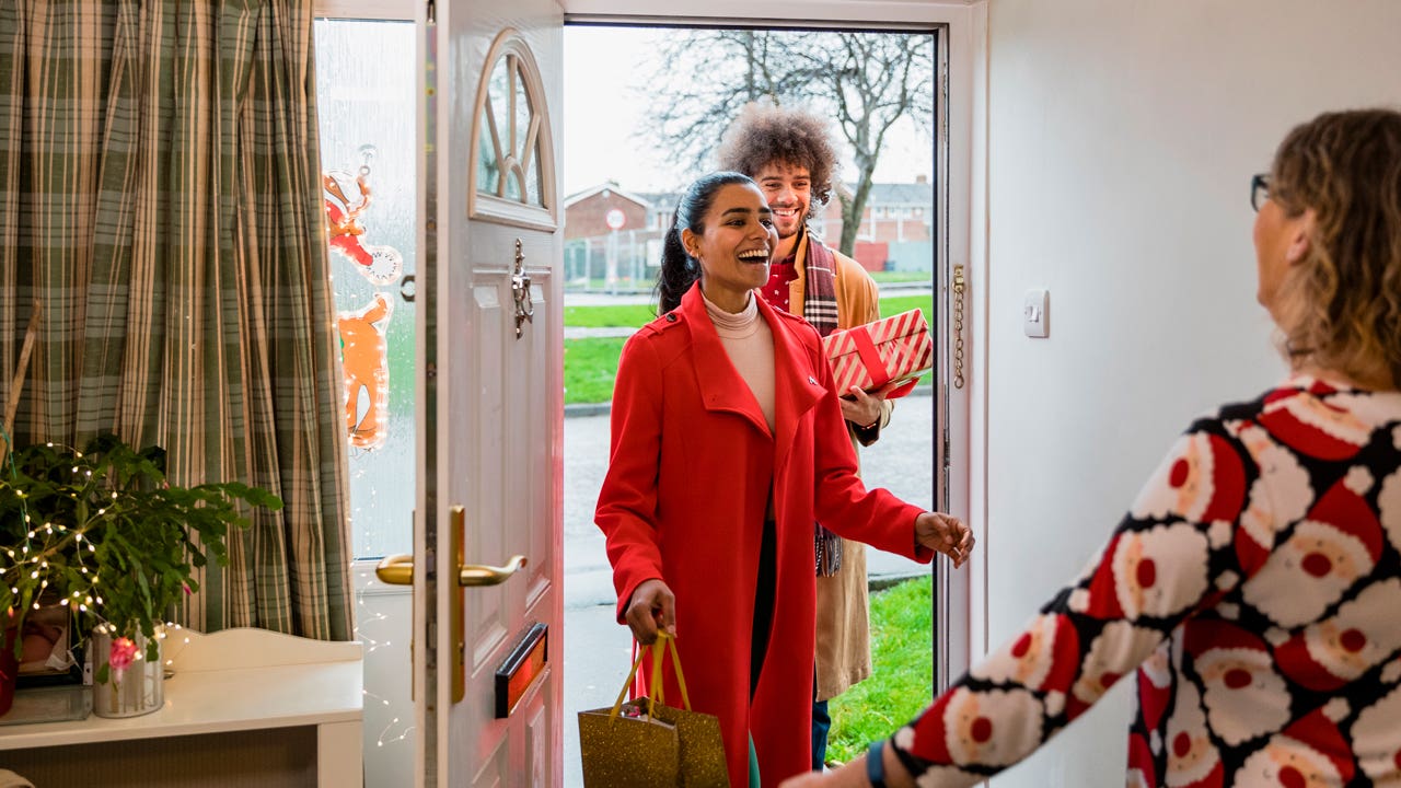 visitors arriving at a house for Christmas