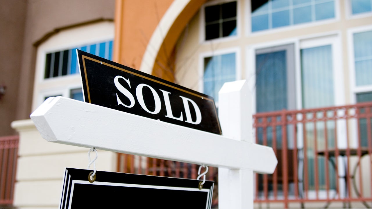 sold sign in front of a house