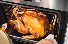 removing a turkey from the oven