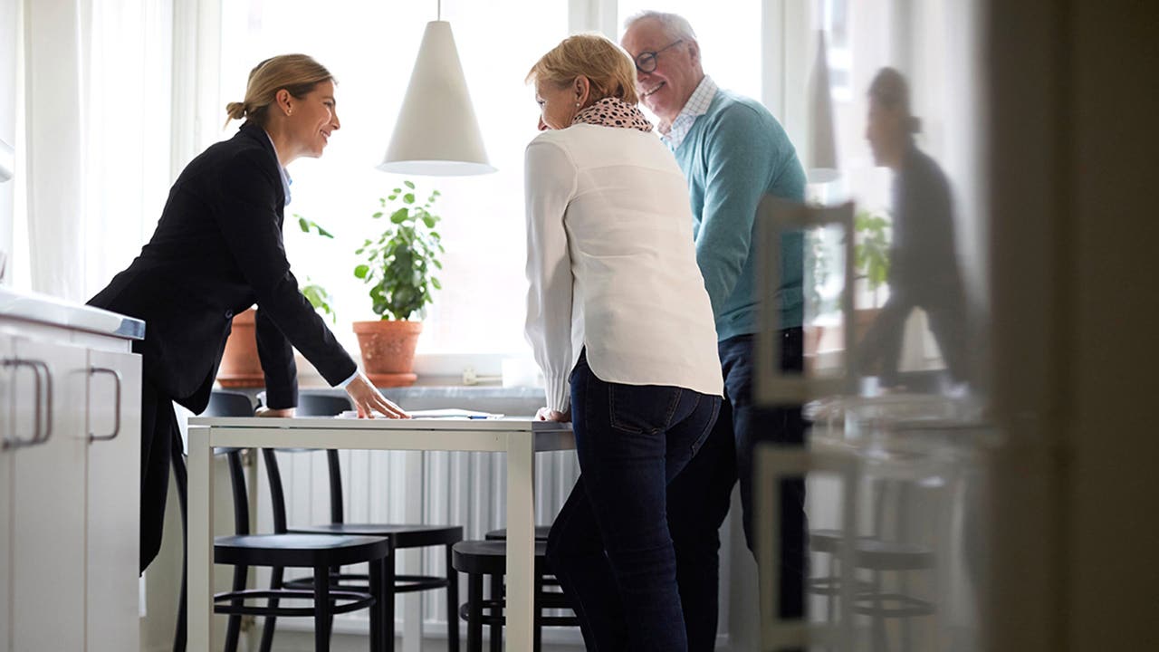 couple signing real estate papers