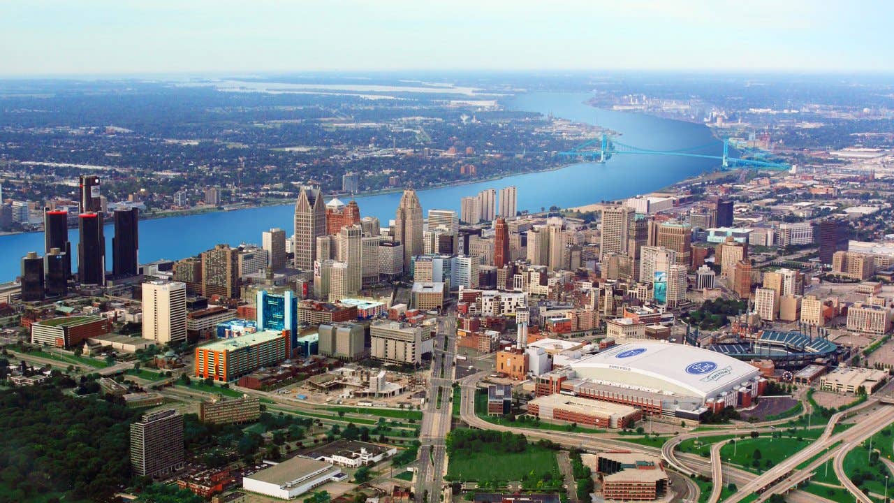 an aerial view of Detroit, Michigan and the Detroit River