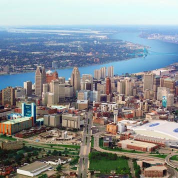 an aerial view of Detroit, Michigan and the Detroit River