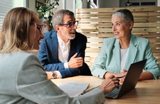 A financial advisor meets with a client couple