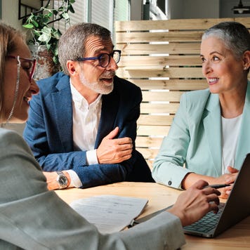 A financial advisor meets with a client couple