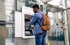 man using an ATM machine
