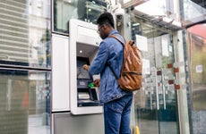 man using an ATM machine