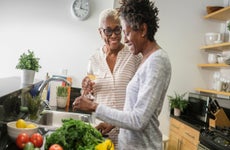 Two women cook together