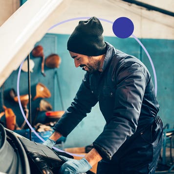 man working on car