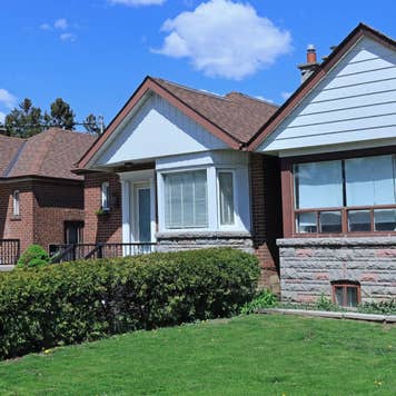 Row of small brick bungalow houses with gables