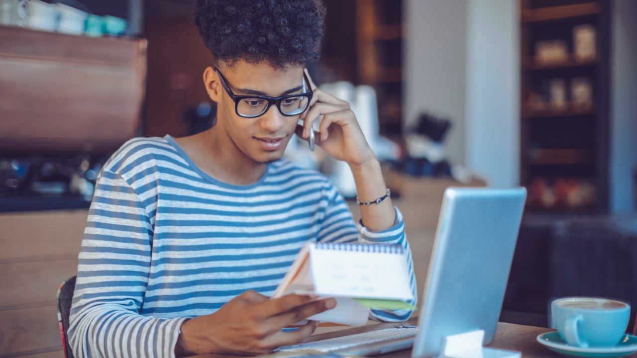 Young man working at home office
