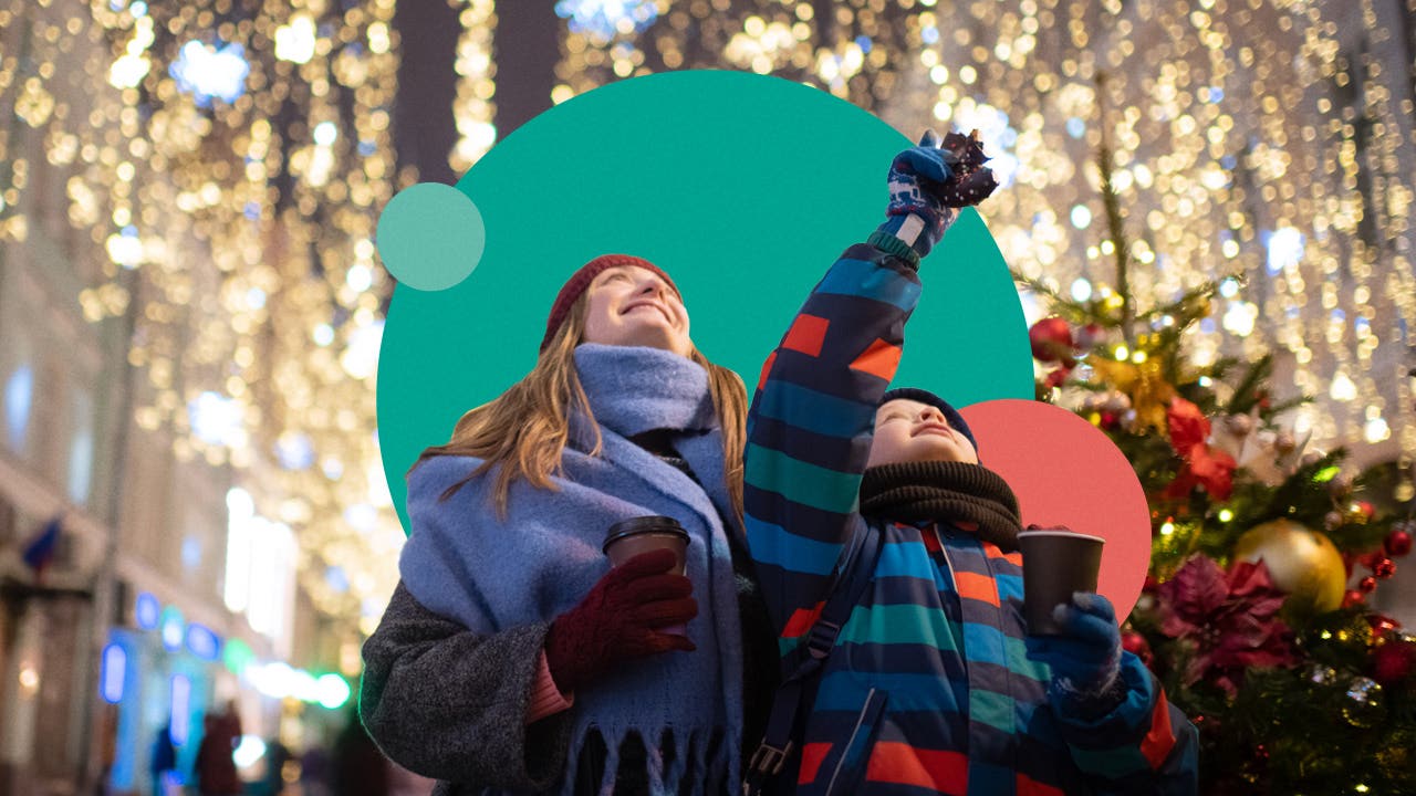 Mother and child looking at outdoor holiday decorations