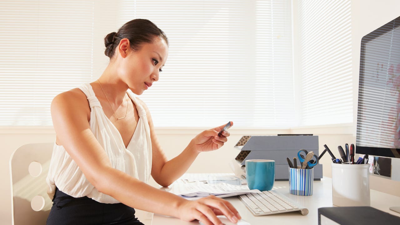 Chinese businesswoman shopping online with credit card