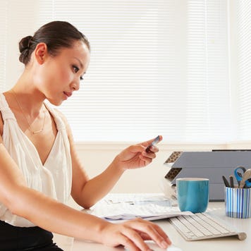 Chinese businesswoman shopping online with credit card