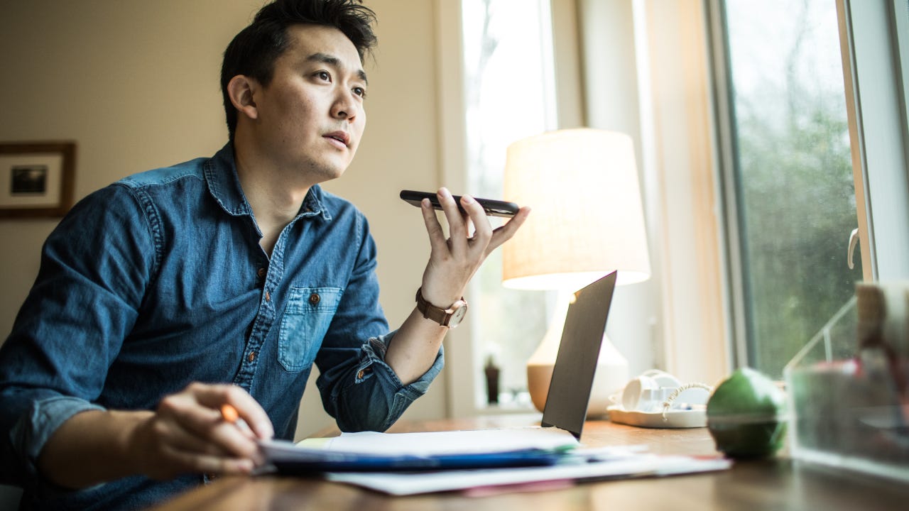 Man in early 30s working in home office