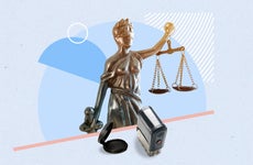 Image of statue holding scales and notary tools