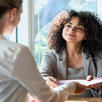 BIPOC woman meeting with female financial advisor