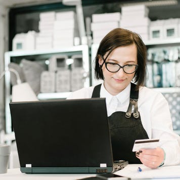 Business Owner Paying Bills Online