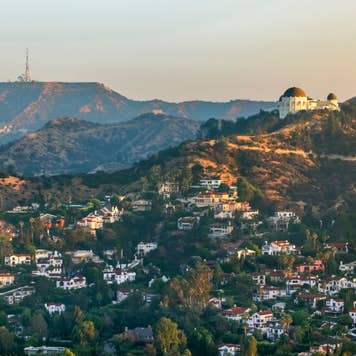 Aerial view of the Griffith Observatory on Mount Hollywood and the Hollywood Sign seen in the distance, California, USA.