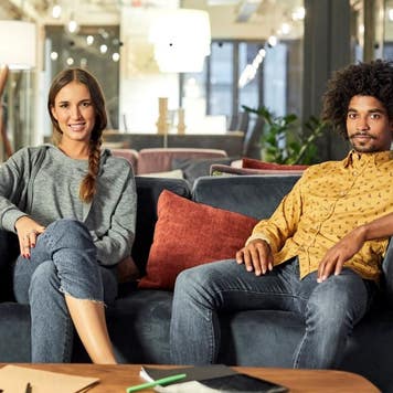 Man and woman sitting on a couch