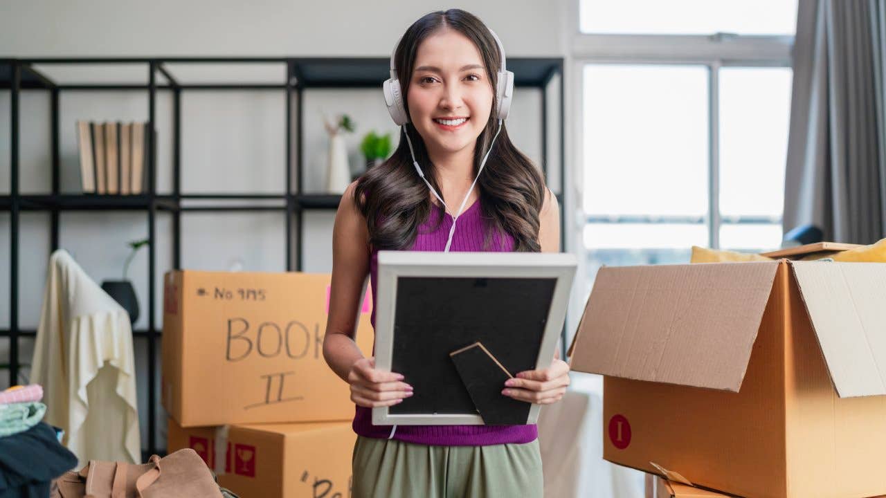 Adult asianwoman female in casual cloth standing on floor preparing for moving to new house