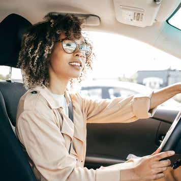 Young woman driving car