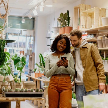 Young couple in flower shop