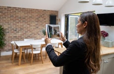 Real estate agent doing a virtual showing of a property using a tablet computer
