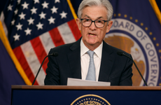 Fed Chair Jerome Powell at a podium speaking
