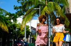 Young women enjoying city life on sunny day