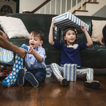 Happy young children with presents